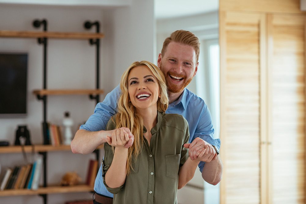 Happy couple in new home