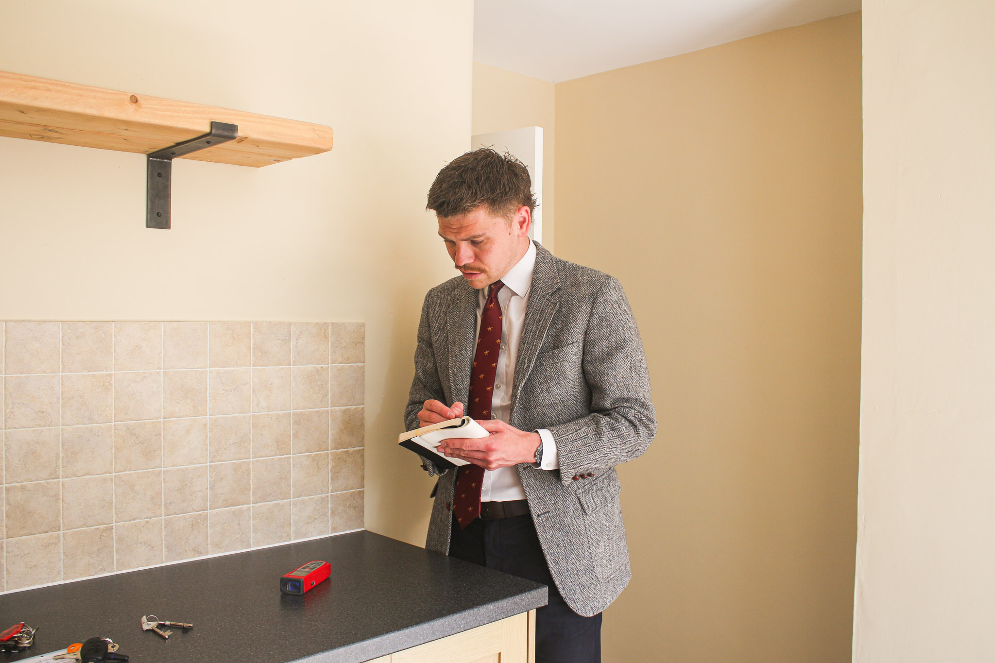 lettings manager filling out compliance paperwork