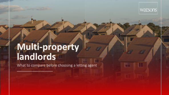 Landlord reviewing several rental property documents before choosing a letting agent