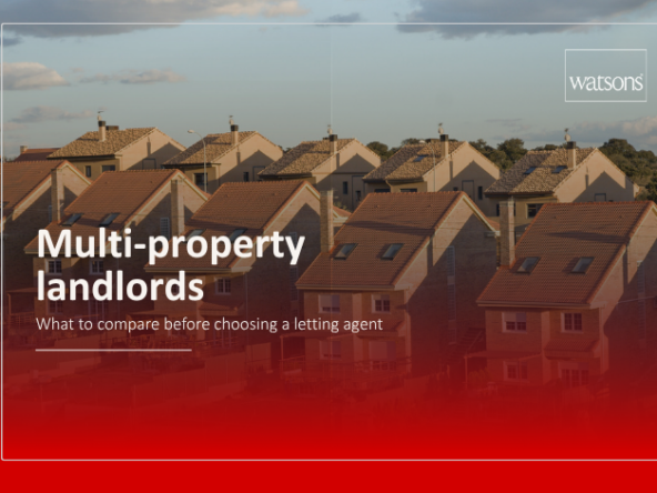 Landlord reviewing several rental property documents before choosing a letting agent